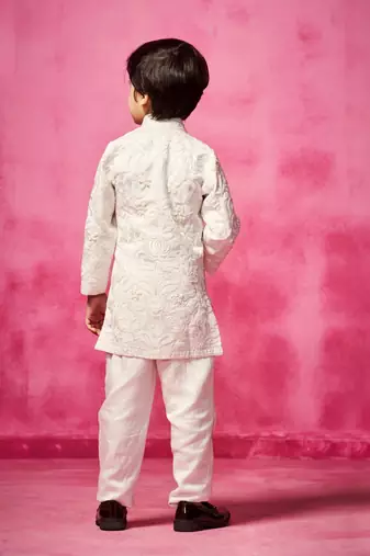 White embroidered satin jacket paired with pant