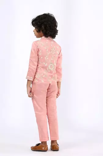 Peach embroidered satin jacket paired with pant