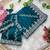 teal rangoli silk blend embroidered saree with stitched blouse