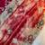abstract printed red twile net saree with stitched blouse