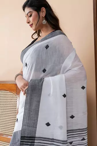 White khadi cotton with heavy jamdani palla and tassels saree