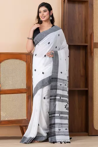 White khadi cotton with heavy jamdani palla and tassels saree