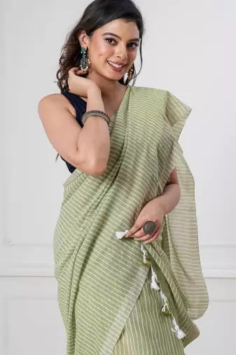 Light green khadi cotton all over stripes and tassels saree
