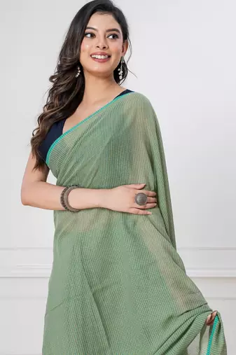 Light green handloom mark mul cotton all over small checks with tassels saree