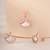White cubic zirconia pendant set with seashell design