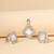 White cubic zirconia pendant set with geometric design