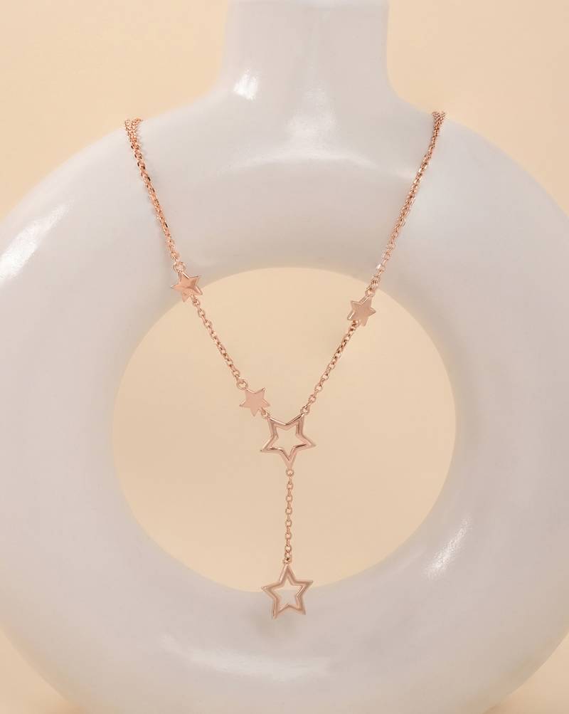 Star-shaped cz rose gold pendant necklace with celestial design and sparkling finish