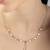 Star cascade cz multicolour necklace with graduated design and sterling chain