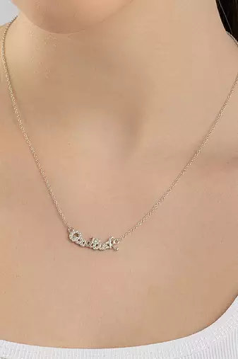Engraved silver pendant necklace with 'good luck' inscription and sleek design