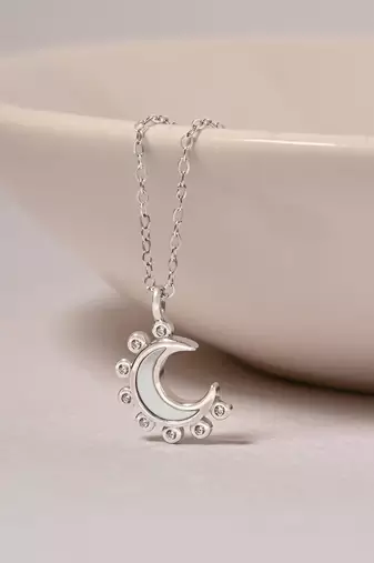 Half-moon cz silver pendant necklace with spike design and modern elegance