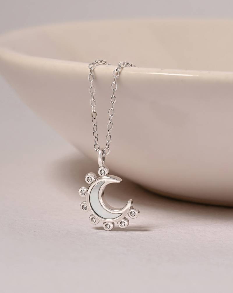 Half-moon cz silver pendant necklace with spike design and modern elegance