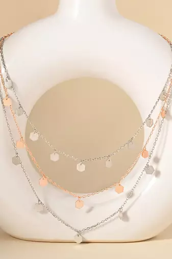 Triple layered heart charm necklace with gold chain accent and romantic touch