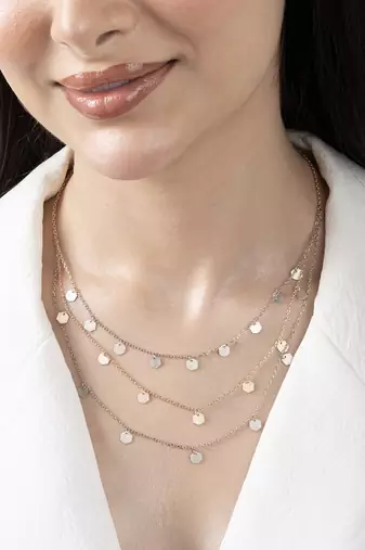Triple layered heart charm necklace with gold chain accent and romantic touch