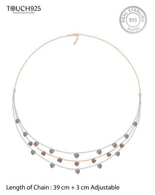 Triple layered heart charm necklace with gold chain accent and romantic touch 4