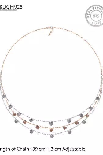 Triple layered heart charm necklace with gold chain accent and romantic touch