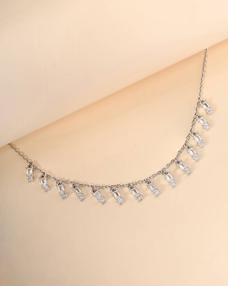 Multi-charm cz silver necklace with beads and playful detail