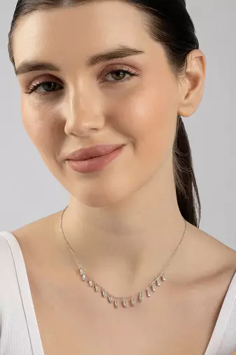 Multi-charm cz silver necklace with beads and playful detail