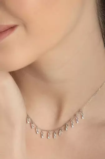 Multi-charm cz silver necklace with beads and playful detail