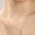 Heart-shaped cz silver pendant necklace with trailing stones and romantic vibe