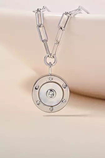 Hexagon cz cluster silver necklace with circular design and radiant center stone