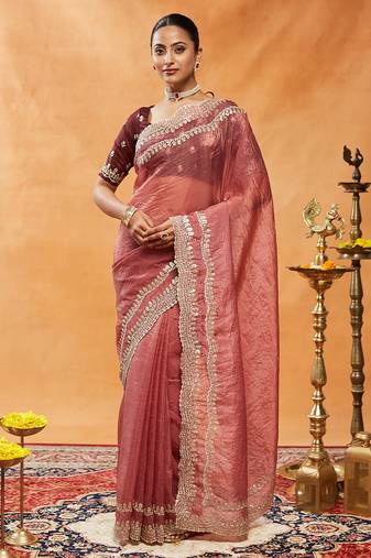 Rust embellished sequinned embroidered organza saree