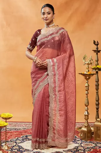 Rust embellished sequinned embroidered organza saree