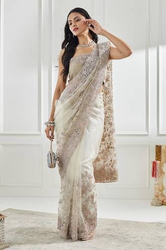 Gold floral beads and stones embellished net saree