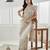 Gold floral beads and stones embellished net saree