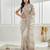 Gold floral beads and stones embellished net saree