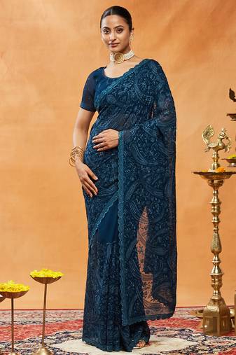 Turquoise blue woven embroidered georgette saree