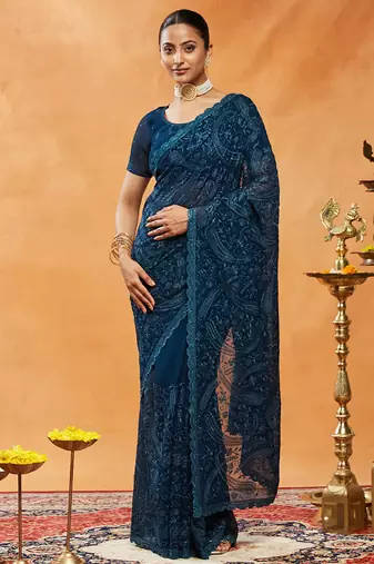 Turquoise blue woven embroidered georgette saree