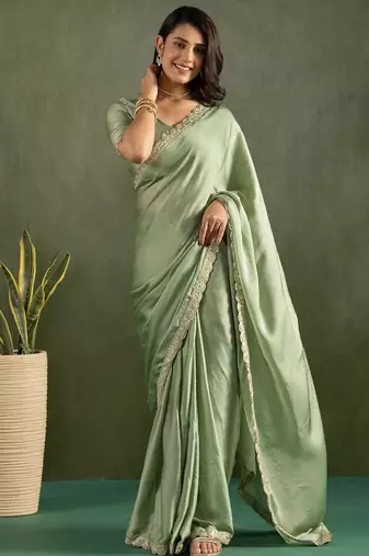 Green chiffon heavy lace border work party wear saree