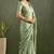 Green chiffon heavy lace border work party wear saree