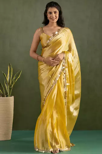 Yellow chiffon heavy lace border work party wear saree