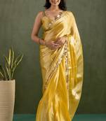 Yellow chiffon heavy lace border work party wear saree