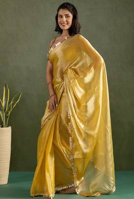 Yellow chiffon heavy lace border work party wear saree 4