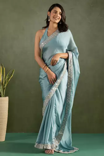 Sky blue chiffon heavy lace border work party wear saree