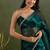 Teal green chiffon heavy lace border work party wear saree