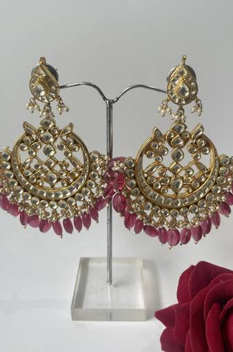 Gold plated pink stone dangle earrings