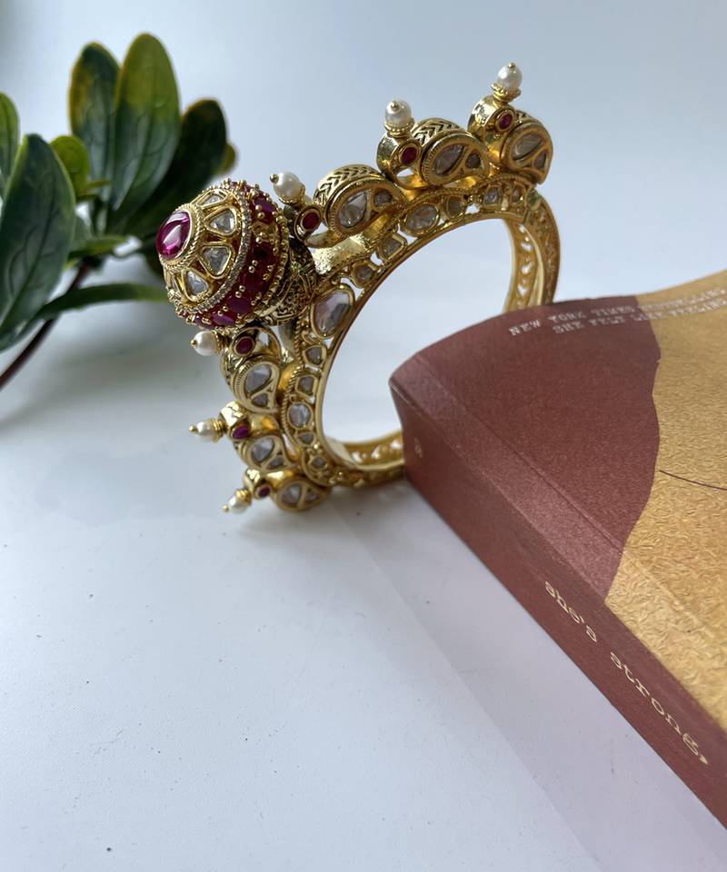 Gold plated pink stone bangle