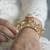 Gold plated pink stone bangle