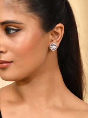Silver-toned floral ad stud earrings 1