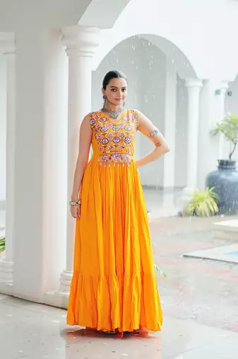 Yellow rayon kutchi gamthi thread embroidered & mirror work navratri gown