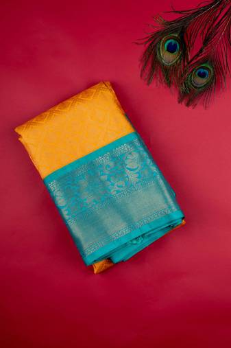 Golden yellow brocade semi silk saree