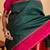 Dark green silk saree with pink border