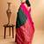 Dark green silk saree with pink border