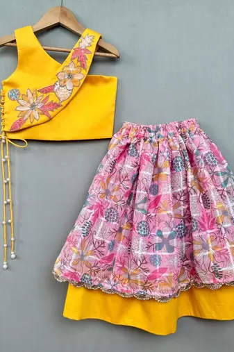 Trendy top with floral applique embroidery and matching pink lehenga for girls
