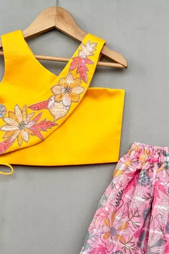 Trendy top with floral applique embroidery and matching pink lehenga for girls