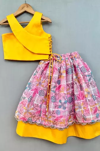 Trendy top with floral applique embroidery and matching pink lehenga for girls