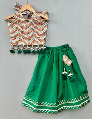 Stylish halter top with matching green lehenga for girls 1
